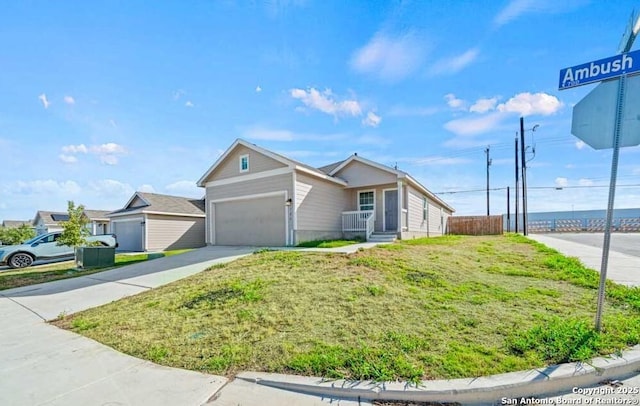 ranch-style house with a garage and a front lawn