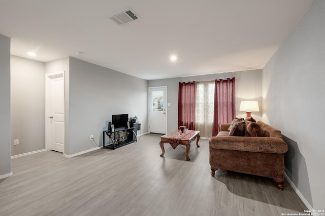 living room with light hardwood / wood-style floors