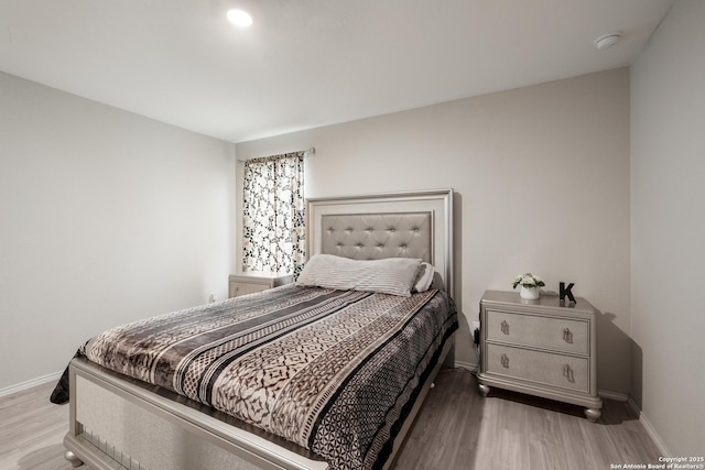 bedroom featuring wood-type flooring