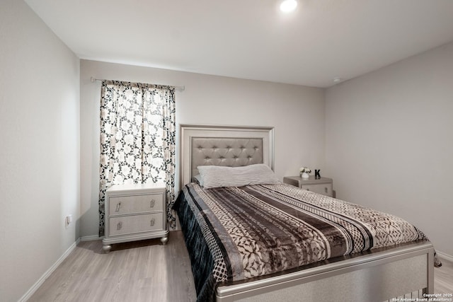 bedroom with light wood-type flooring