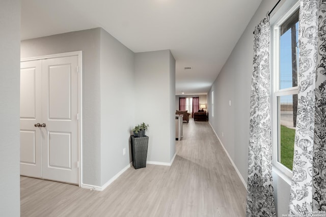 hallway with light wood-type flooring