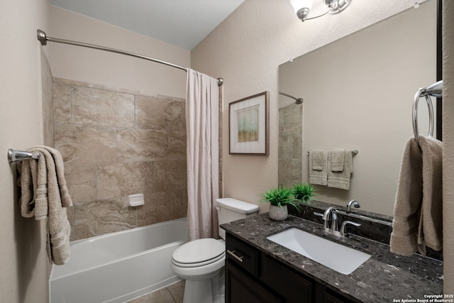 full bathroom with tile patterned flooring, shower / tub combo, vanity, and toilet