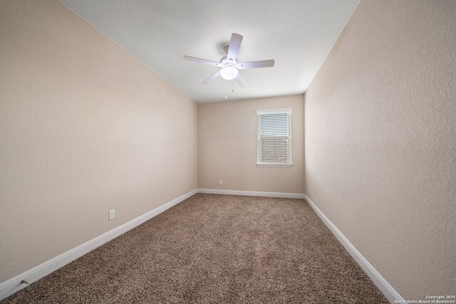 spare room with carpet and ceiling fan