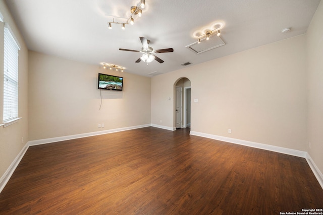 spare room with ceiling fan and dark wood-type flooring