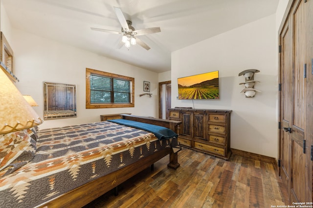 bedroom with ceiling fan and dark wood-type flooring