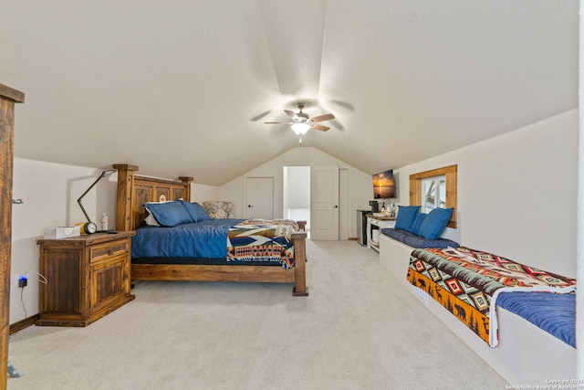 bedroom with light carpet, ceiling fan, and lofted ceiling