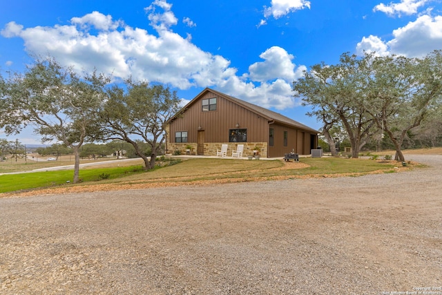 view of home's exterior with central AC unit and an outdoor structure