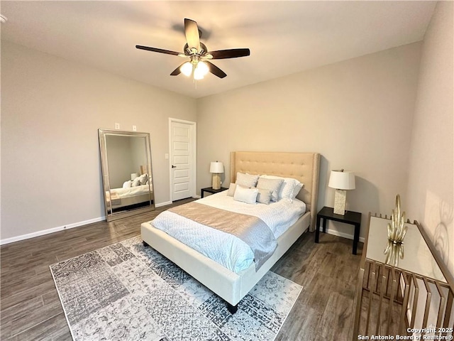 bedroom featuring ceiling fan and dark wood-type flooring