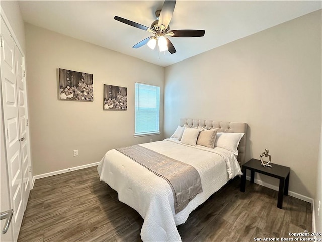 bedroom with a closet, ceiling fan, and dark wood-type flooring