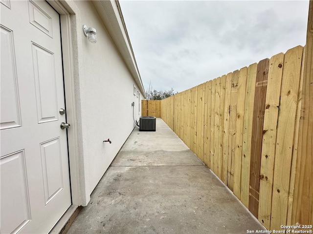 view of side of property with cooling unit