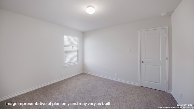 empty room featuring carpet floors