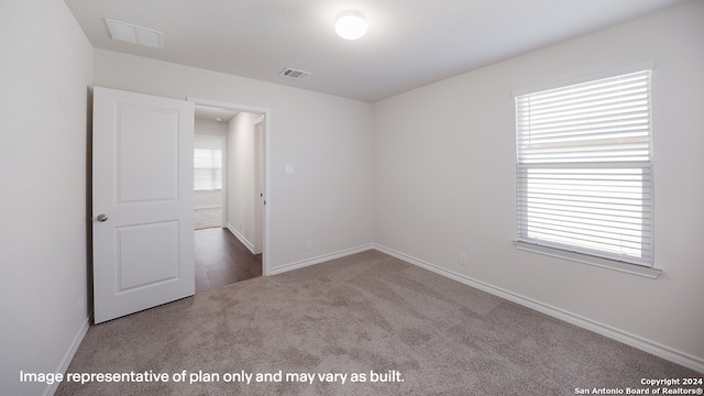 empty room featuring carpet flooring