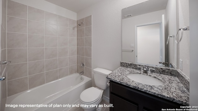 full bathroom with vanity, toilet, and tiled shower / bath combo