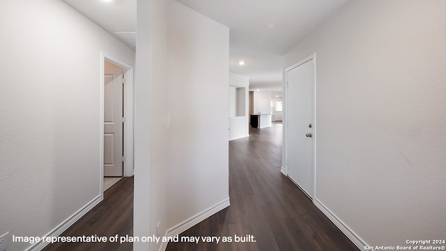 hall with dark wood-type flooring