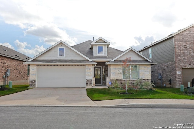 view of front of home with a garage and a front yard