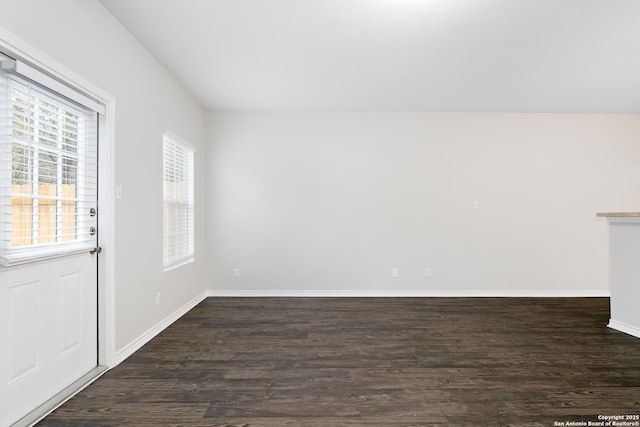 spare room featuring dark hardwood / wood-style flooring