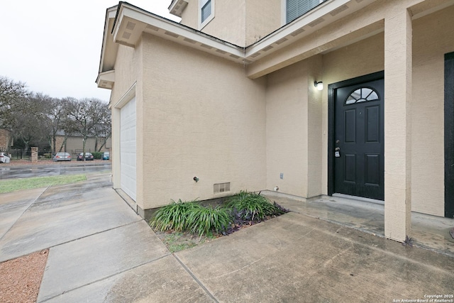 property entrance with a garage