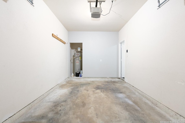 garage with water heater and a garage door opener