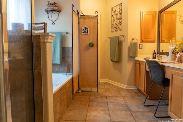 bathroom with tile patterned flooring, shower with separate bathtub, and vanity