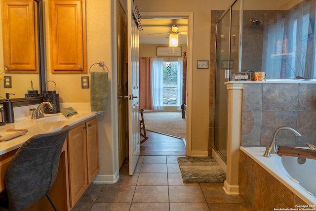 bathroom with tile patterned floors, vanity, and plus walk in shower