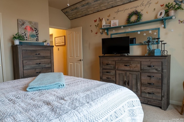 bedroom with light colored carpet and vaulted ceiling