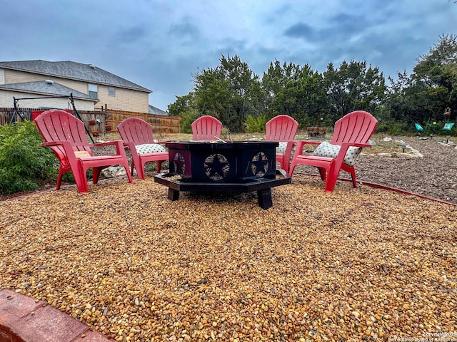 view of yard featuring an outdoor fire pit