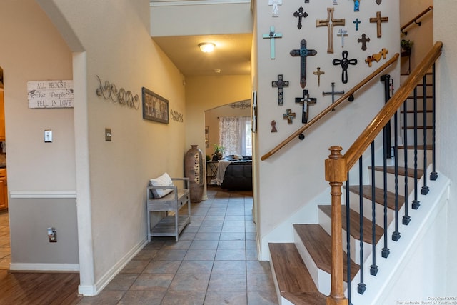 stairs with tile patterned flooring