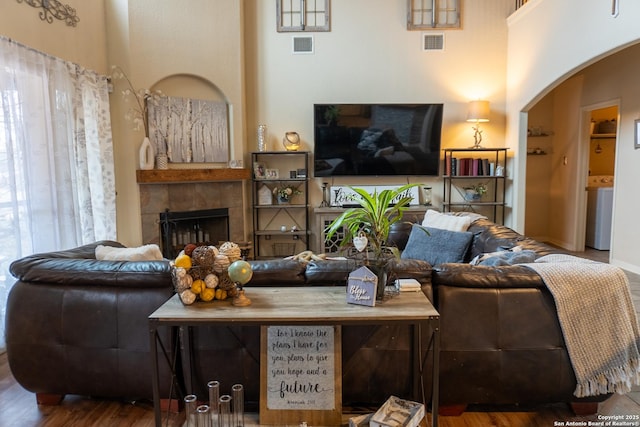 living room with a fireplace and hardwood / wood-style flooring