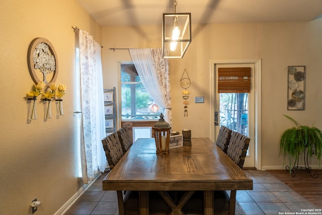 dining space with tile patterned floors and plenty of natural light