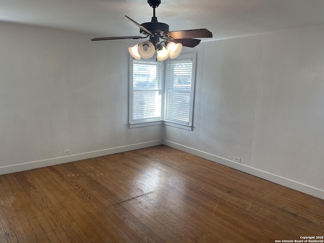 spare room featuring ceiling fan and hardwood / wood-style floors