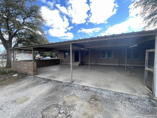 exterior space with a carport