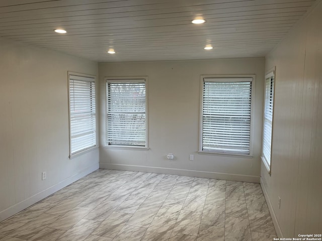 empty room with wood ceiling