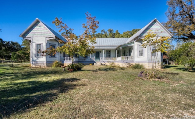 view of front of home featuring a porch and a front lawn