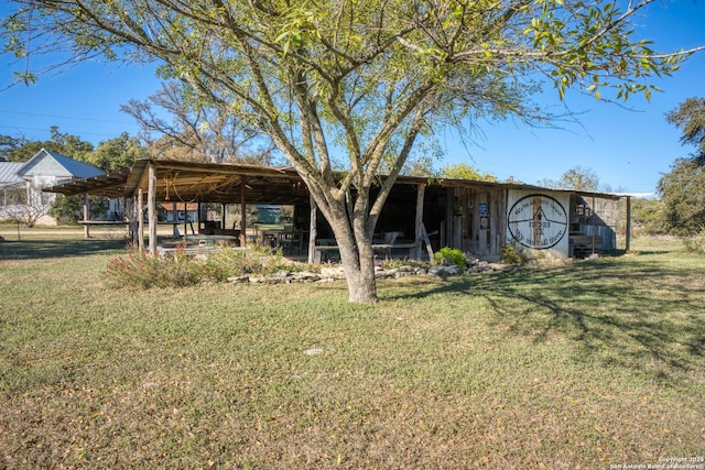 rear view of property with a yard