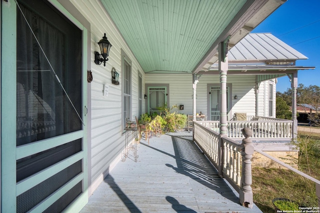 wooden deck featuring covered porch