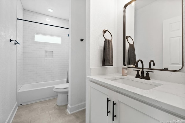 full bathroom featuring vanity, toilet, and tiled shower / bath