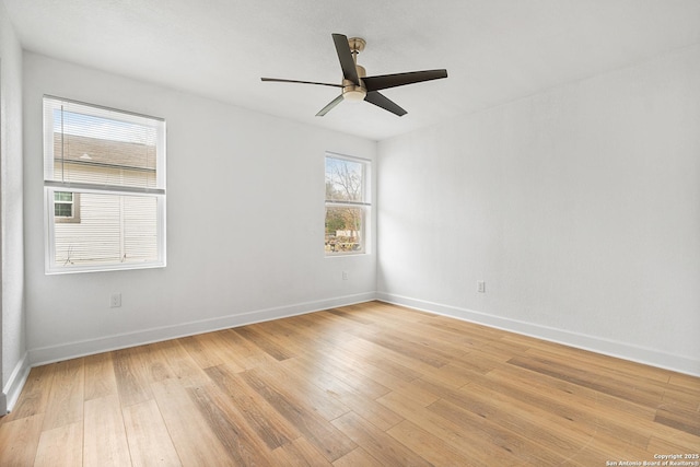 empty room with ceiling fan and light wood-type flooring