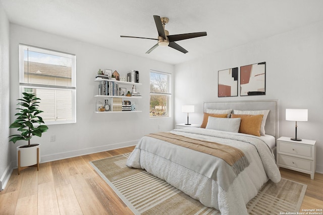 bedroom featuring ceiling fan and light hardwood / wood-style flooring