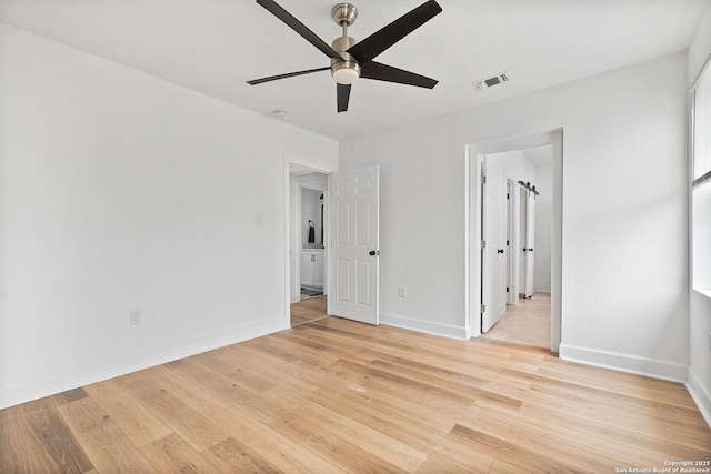 unfurnished bedroom with light wood-type flooring and ceiling fan