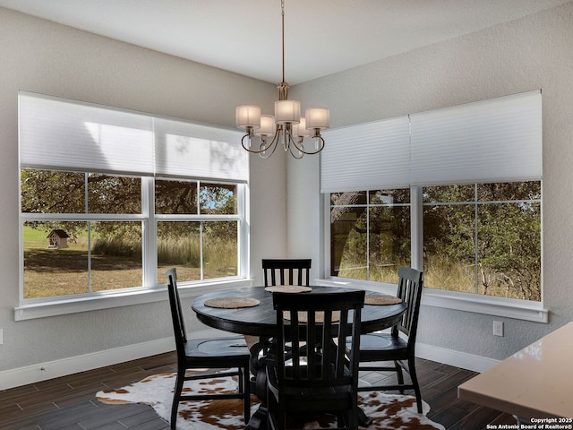 dining space with a notable chandelier