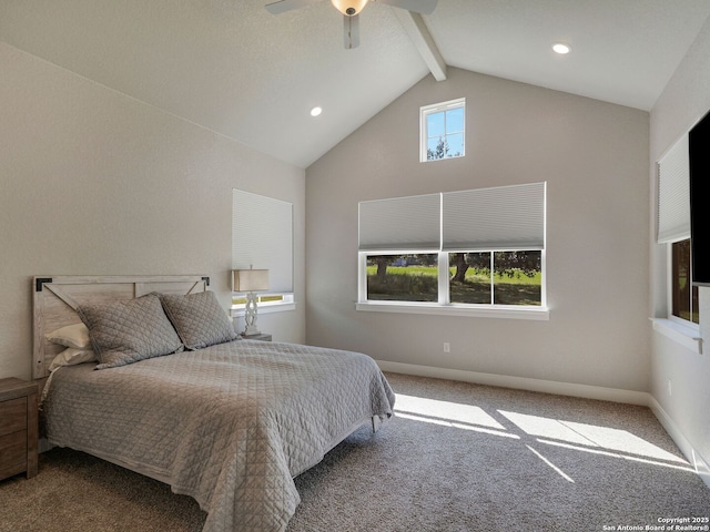 bedroom featuring carpet flooring, multiple windows, ceiling fan, and lofted ceiling with beams