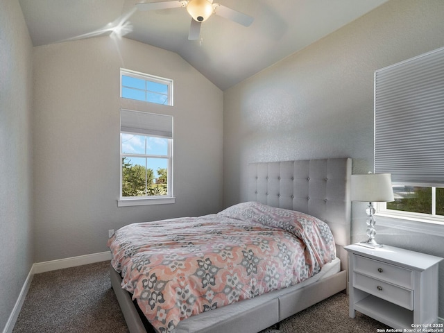 carpeted bedroom featuring ceiling fan and vaulted ceiling