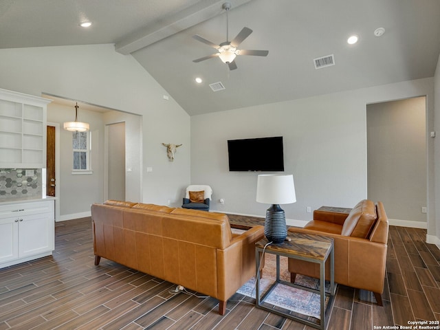 living room featuring ceiling fan and lofted ceiling with beams