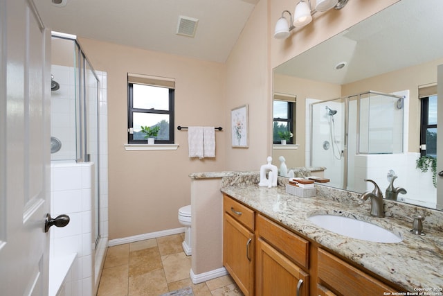 bathroom featuring walk in shower, vanity, and toilet