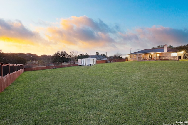 view of yard at dusk