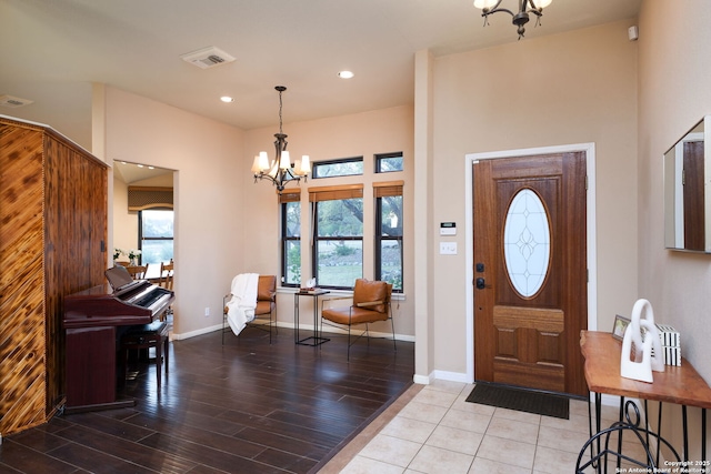 entryway with a notable chandelier