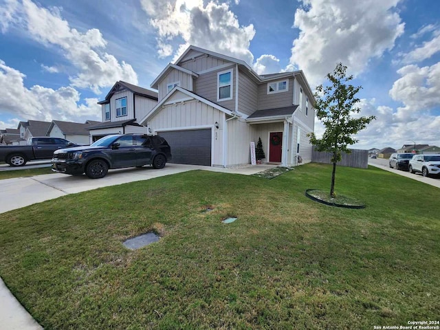 view of front facade with a garage and a front lawn