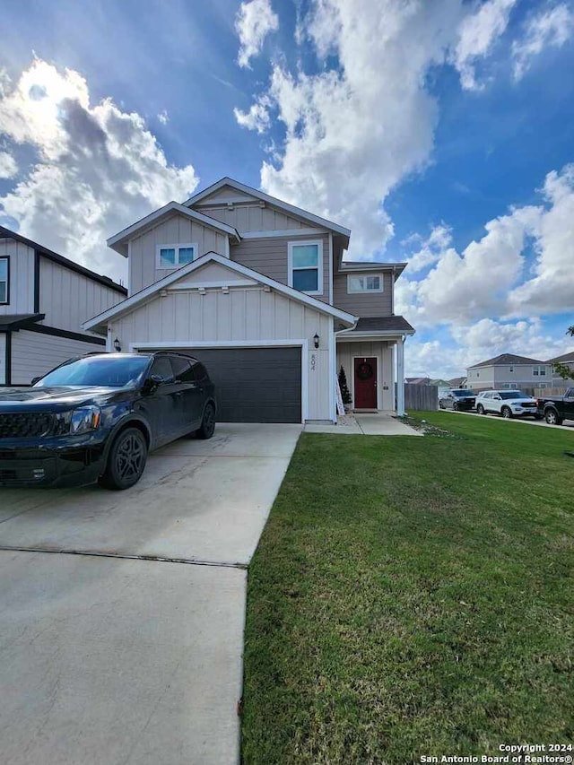 view of front facade with a garage and a front yard