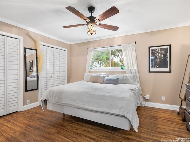 bedroom with dark hardwood / wood-style flooring, ceiling fan, and ornamental molding