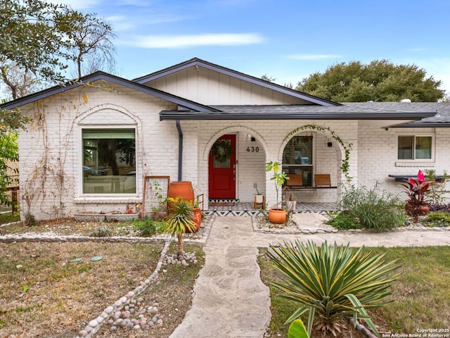 single story home featuring covered porch